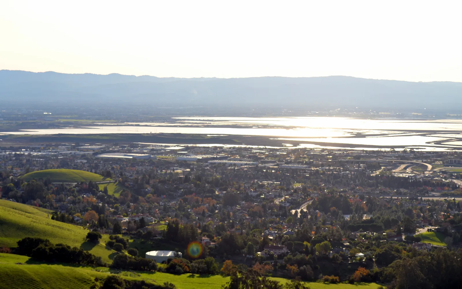 A panoramic vista of South San Francisco Bay viewed from Mission Peak in Fremont, showing the bay, distant hills, and sky